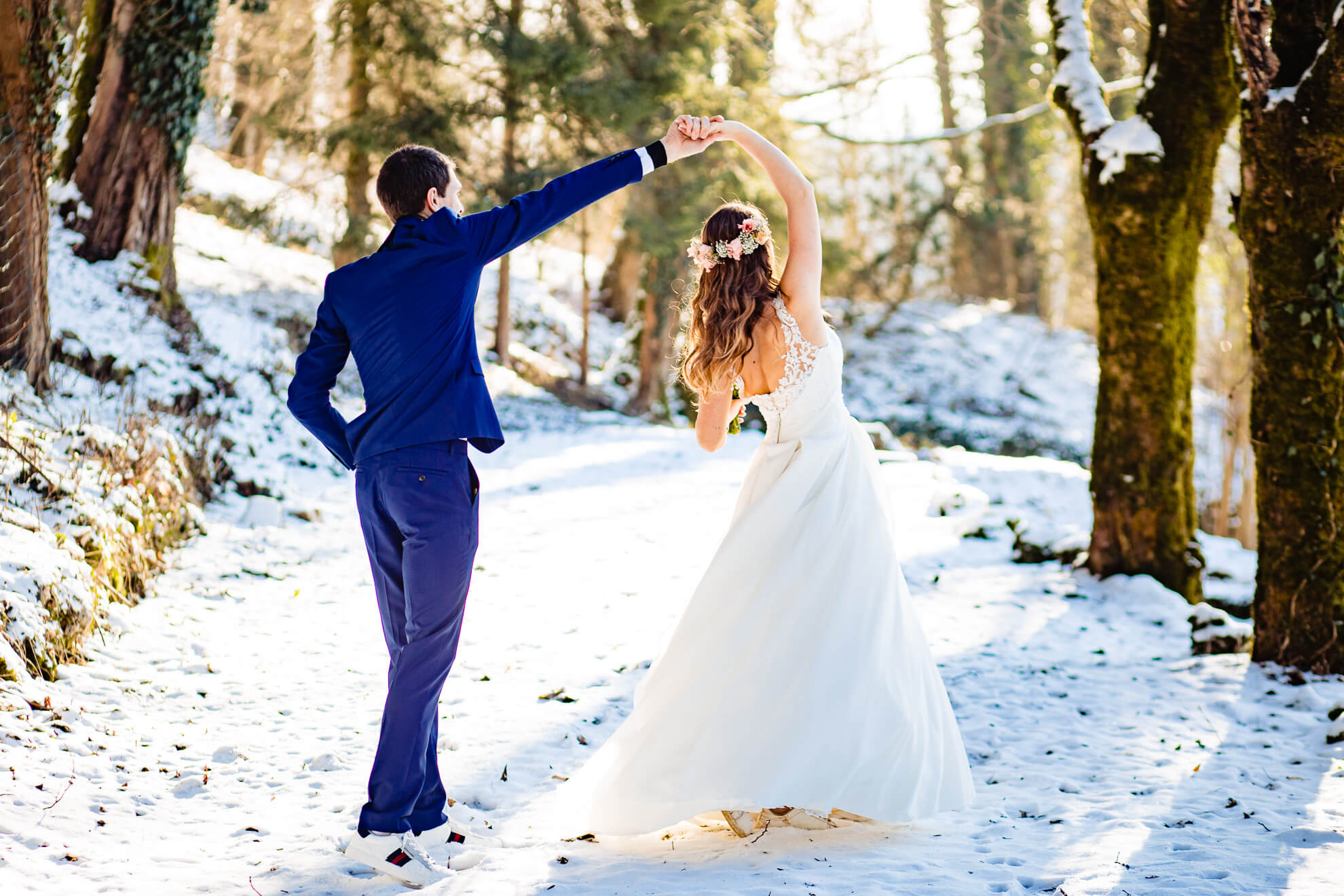 Newlyweds dancing in a snowy garden